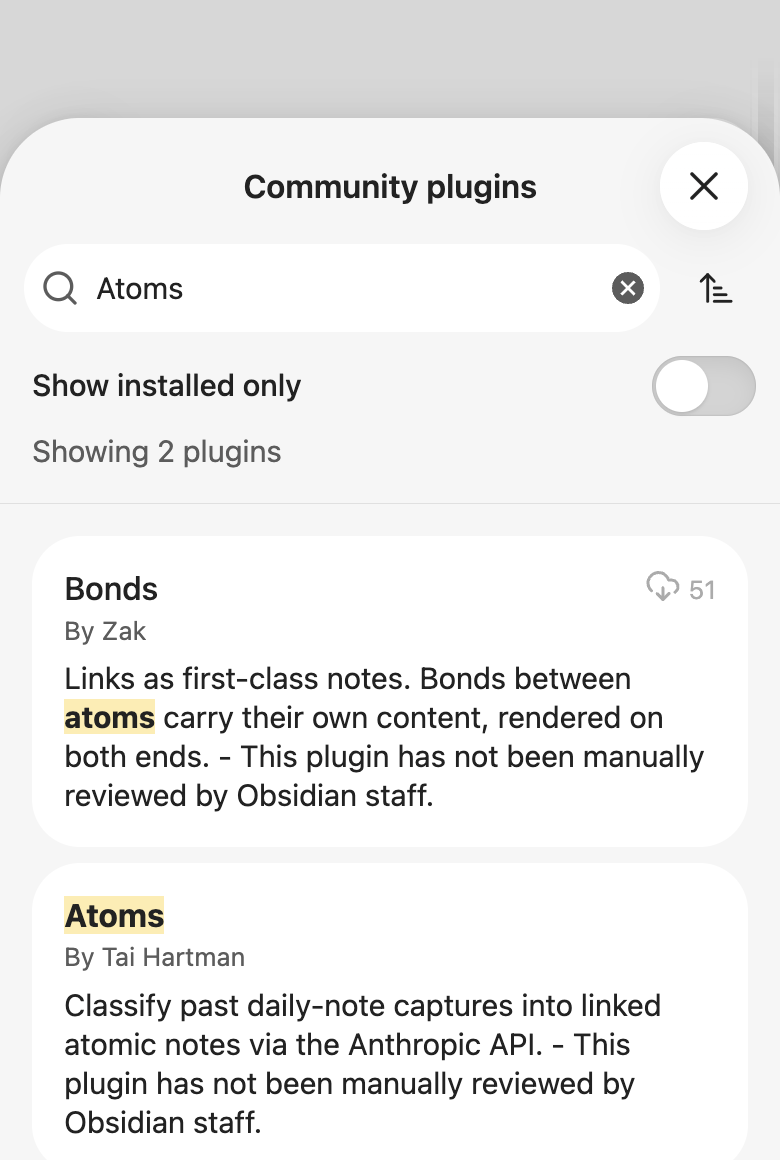 Obsidian's community plugin browser searching for Atoms, showing two results: Bonds by Zak first and Atoms by Tai Hartman second